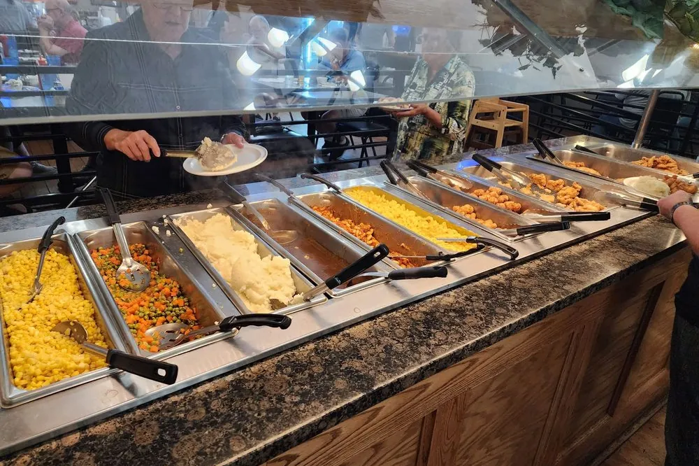 The hot buffet line at Sally's, pans of food under the heat lamps