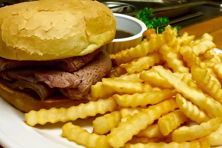 An open faced hot beef sandwich with mashed potatoes and gravy