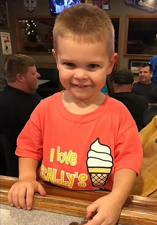 A young regular at Sally's in an I Love Sally's t-shirt with a soft serve cone on the front